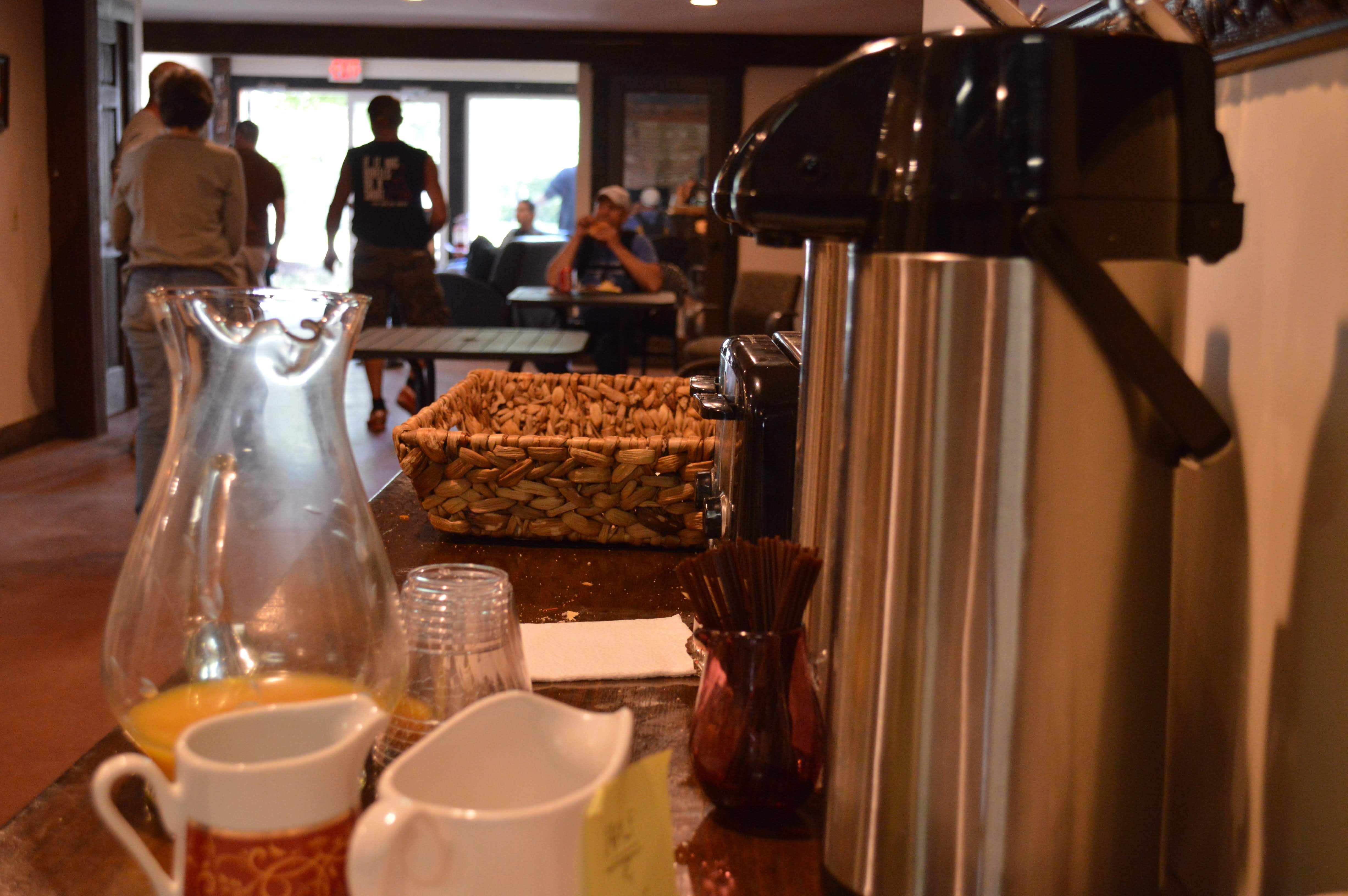 Coffee station with pitcher of orange juice